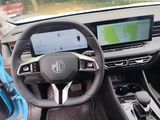 the interior of a car with a steering wheel and dashboard
