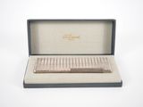an image of a pen sitting in a box on a white surface