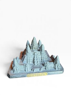 a small model of a mountain with trees on it
