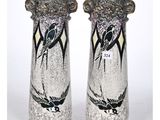 two vases that have birds painted on them