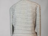 a white and black striped jacket on a mannequin mannequin mannequin mannequin mann