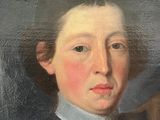 portrait of a young man in a blue coat and white collared shirt