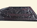 an image of a wooden plaque with a design on it