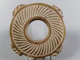 a picture of a decorative object on a white surface