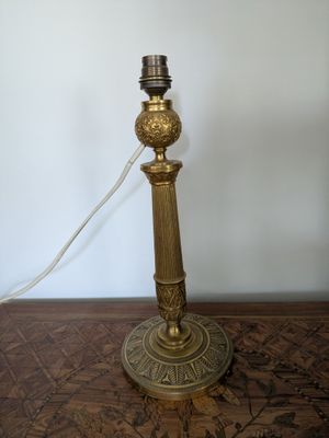 a lamp that is sitting on a table with a cord