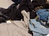 a pile of clothes sitting on a white table