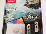 nintendo switch lite with the legend of zelda and the legend of zelda