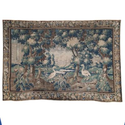 an image of a tapestry hanging on a wall with birds and trees