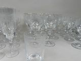 a lot of empty wine glasses sitting on a table