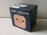 a cardboard box that has a picture of a dinosaur on it