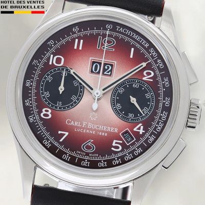 un gros plan d'une montre-bracelet au cadran rouge