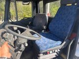 a driver ' s seat in the back of a truck