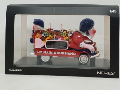 figurine of a man driving a car with a bunch of teddy bears in the back