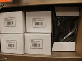 many boxes of packages on a shelf in a store