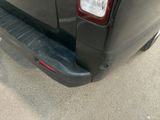 a close up of the rear end of a black van