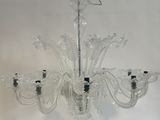 a chandelier made of glass hanging from a ceiling
