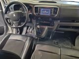 a dashboard of a car with a steering wheel and dashboard controls