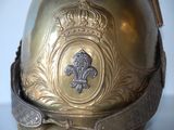 a gold helmet with a crown on top of it