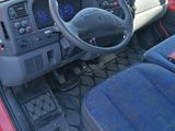 a red car with a steering wheel and a dashboard