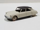 a toy car that is sitting on a white surface