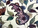 a picture of a decorative plate with a bird on it