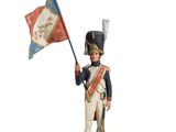 figurine of a soldier holding a flag and a flag pole