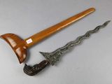 an image of a knife and a wooden handle on a table