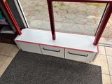 a red and white window sill next to a door