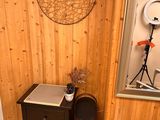 a chair and a table in a room with wood paneled walls