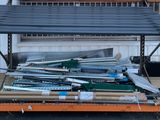 a lot of metal items on a shelf in front of a building