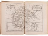 an old book with a map of the world on it