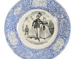 blue and white plate with an image of a man and woman