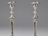 pair of antique silver candlesticks on stands
