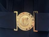 belt with a gold buckle on it and a gold buckle on the back of the belt