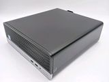 an image of a black computer sitting on top of a white surface