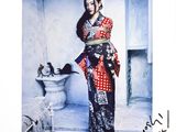 signed photograph of a woman in a red and black sari