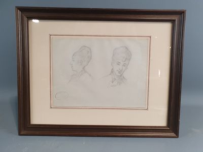 a drawing of two heads of a woman and a man in profile