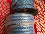 a red basket with a blue rope in it