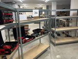many shelves with tools on them in a room