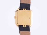 a close up of a watch on a white surface