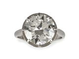 an old cut diamond ring on a white background