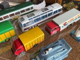 a lot of toy cars that are on a table