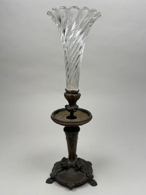an image of a glass vase on a stand on a white background