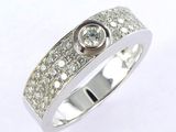 a close up of a diamond ring on a white background