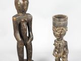 pair of carved wooden figures of a man and a woman
