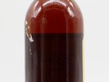 bottles of liquor on a white surface with a white background