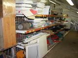 a room with a lot of items on the shelves