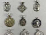 a close up of a bunch of silver and gold medals