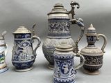 five different types of blue and white vases and one has a dragon on it