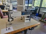 a sewing machine sitting on a table in a room